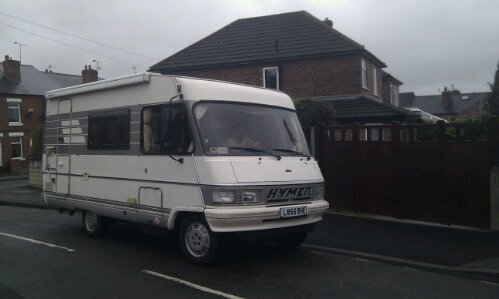 Ourtour's classic Hymer B544 motorhome outside their house in the UK at the start of a two-year tour of Europe and North Africa