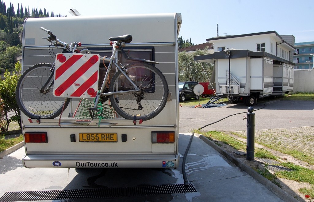Cheeky pipe going from big motorhome to waste water grate