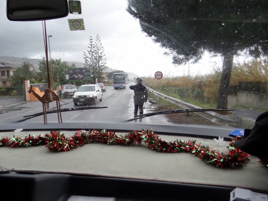 Being waved past car accident by the local rozzers - Panda in barrier is next to our camel.