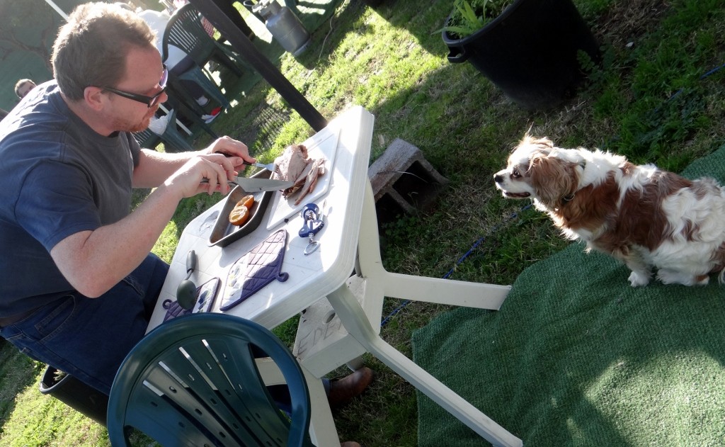 Charlie takes a serious interest in Jay's goose carving