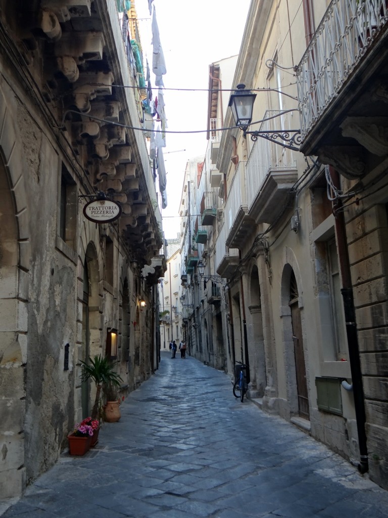 Satnav's favourite type of street - so narrow you could pass stuff from balcony to balcony!