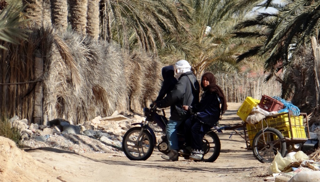 A whole family on one bike - the most people we've seen so far is four on one scooter!