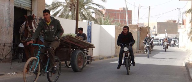 Mopeds buzzin' about Douz like whipped wasps.