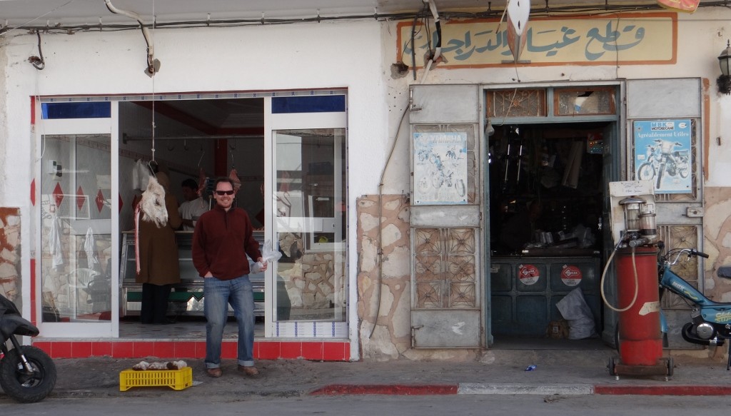 The camel doesn't look too impressed that Jay has his insides in that bag