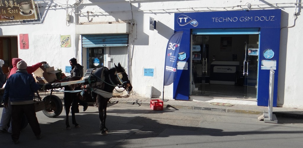 There are telecoms shops everywhere. They look false, all clean plastic, not a hand-painted sign in sight.