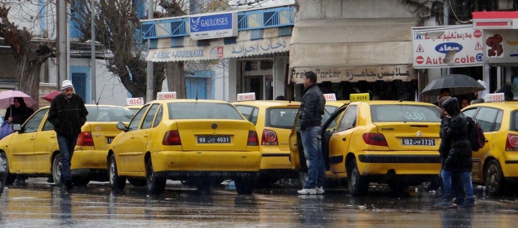 Pouring with rain but no one is getting a taxi.