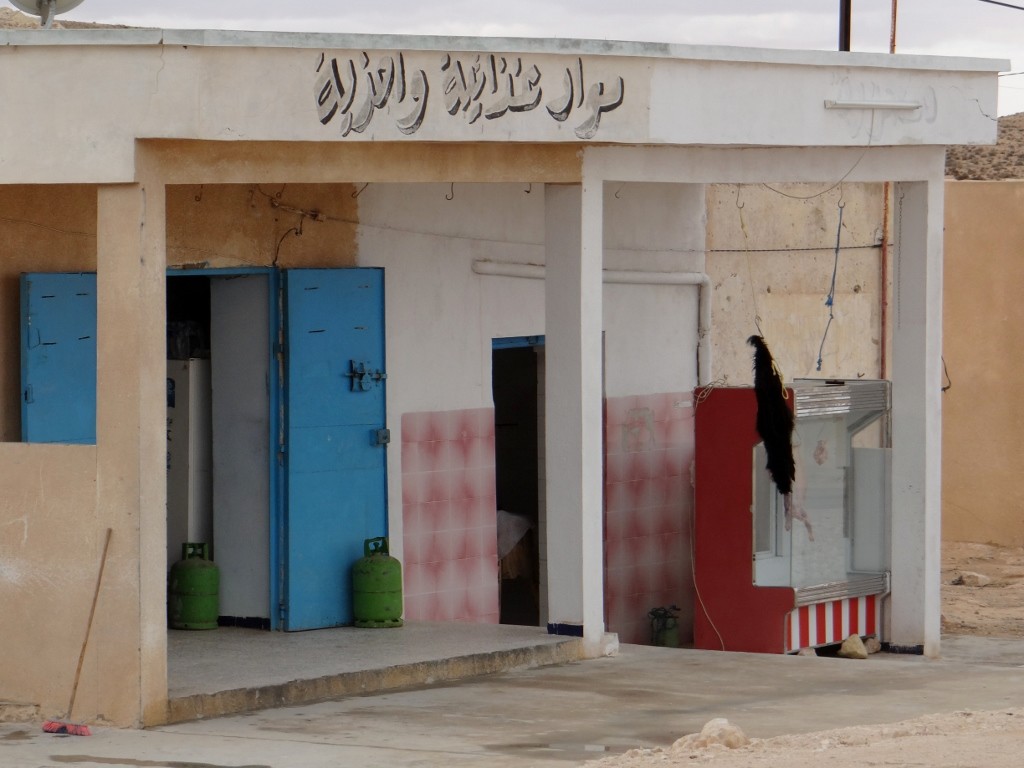 Looks like it's fresh goat today in the butchers - you can tell by the skin hanging outside
