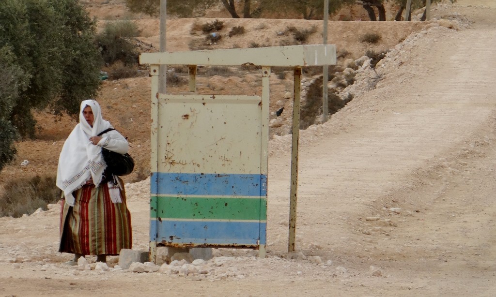 As we drive along we're getting smiles and waves for nearly everyone - but not this lady who is busy waiting for the bus