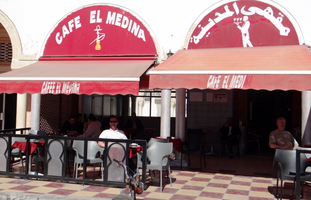 Jay relaxes in the sun in the prime cafe in the medina