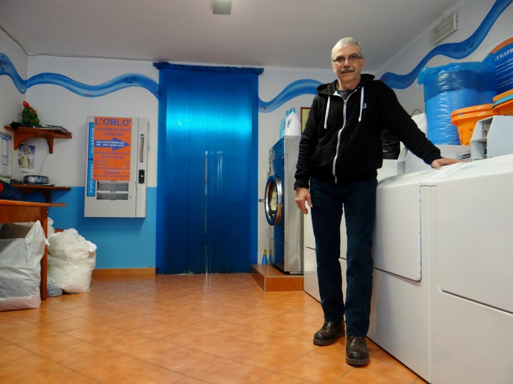 Rosario in his lavanderia - our laundry was too much even for one of the big machines!