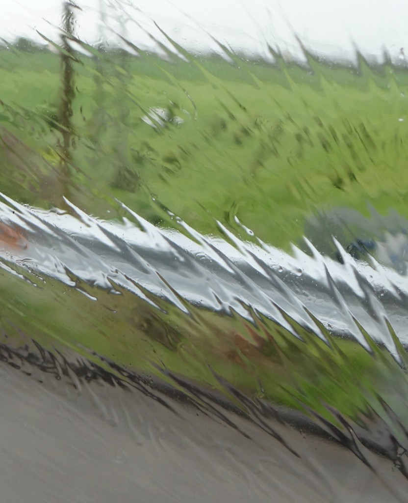 Rain patterns on Dave's window as we fly along the motorway