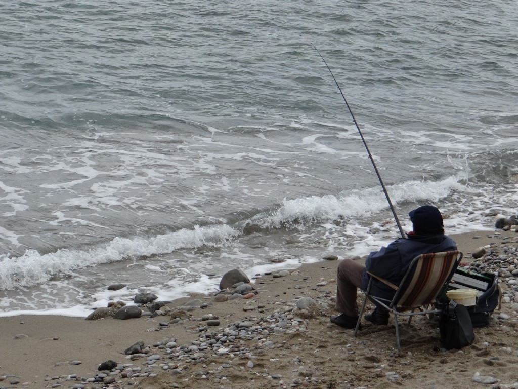 Sunday afternoon fishing on a Giardini-Naxos beach.