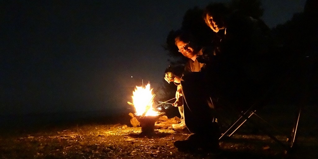 Toasting marshmallows on the beach in our fire pit