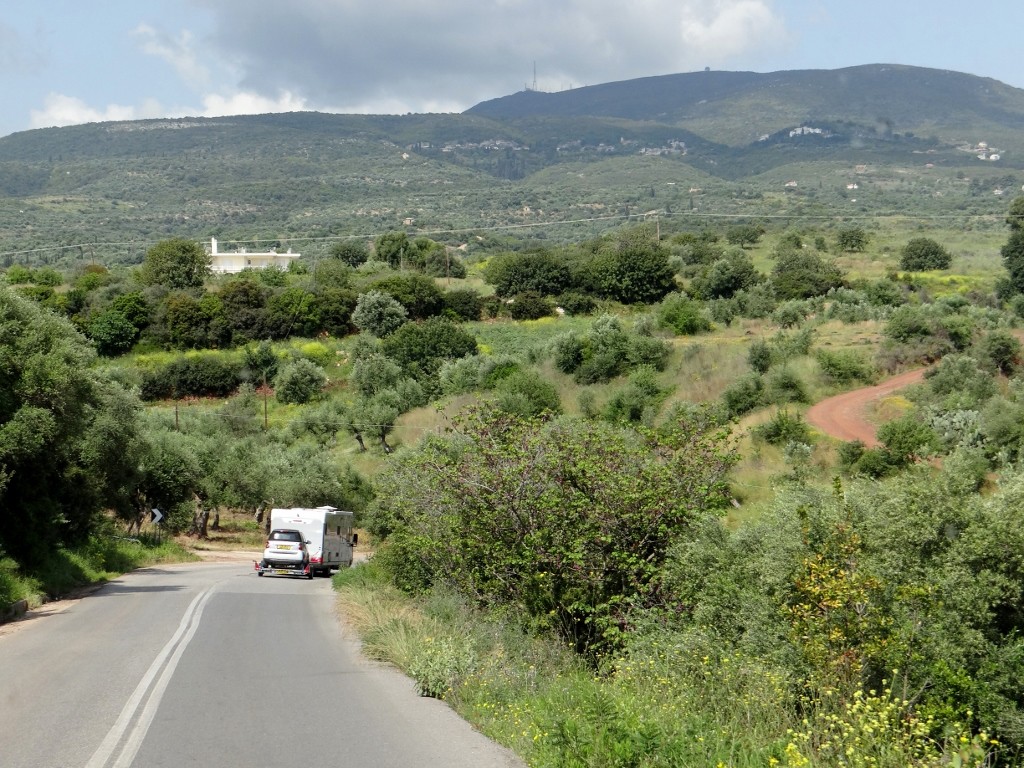 Smiles and waves all around - finally an English motorhome, and it's a Hymer! Towing a smart car that we spotted in Olympia and wondered how on earth it got there!