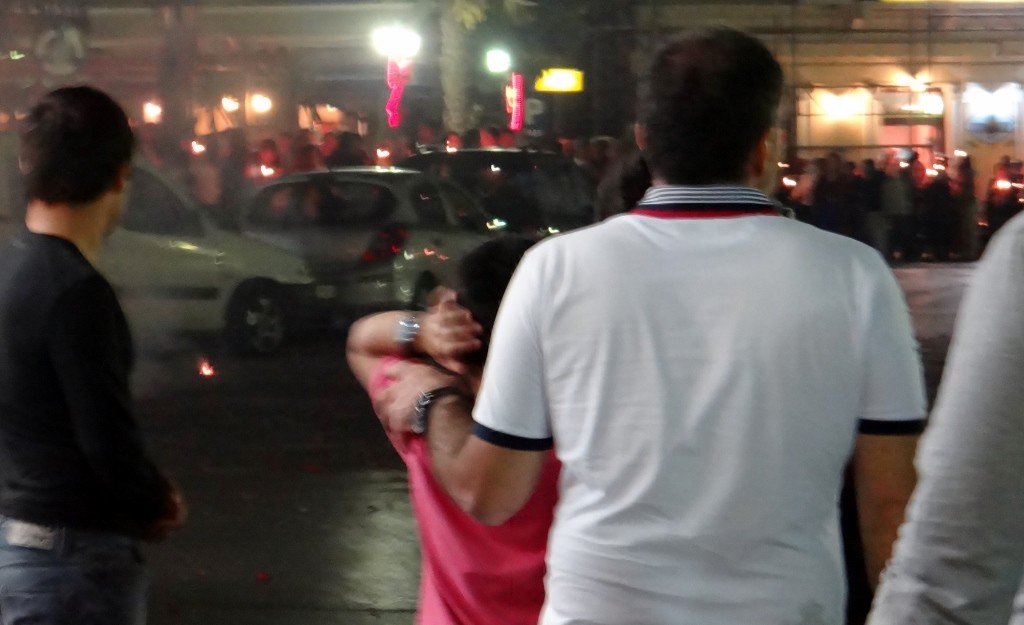 Father comforts his son on the front line of the bangers