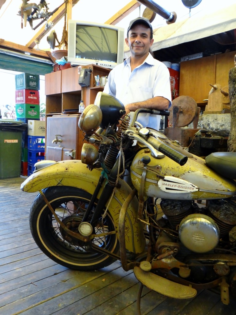 Our waiter and a 1939 Harley Bike that still works - ok it doesn't go, but the engine will tick over