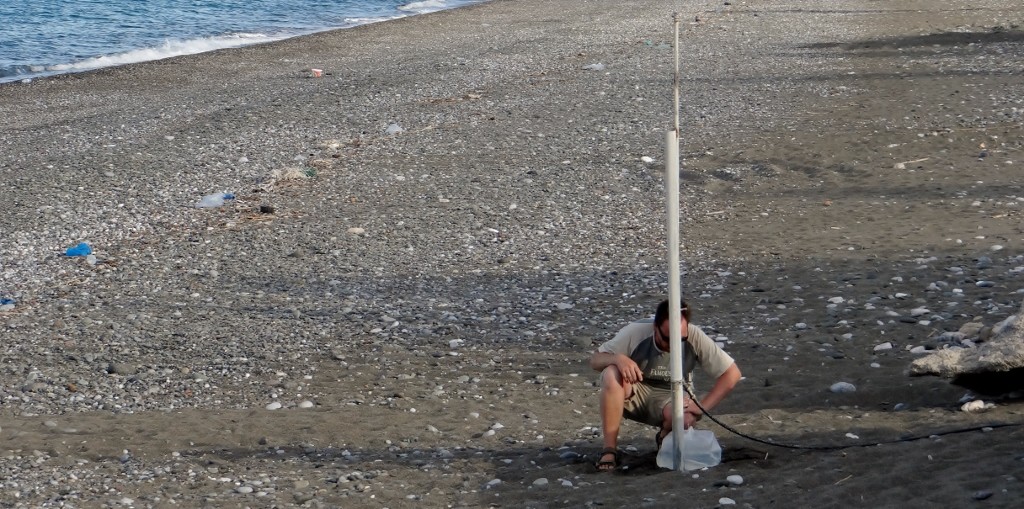 Jay filling Dave up from the beach shower tap