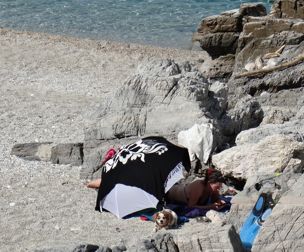 Charlie and me hiding from the rays and have a read on the beach.
