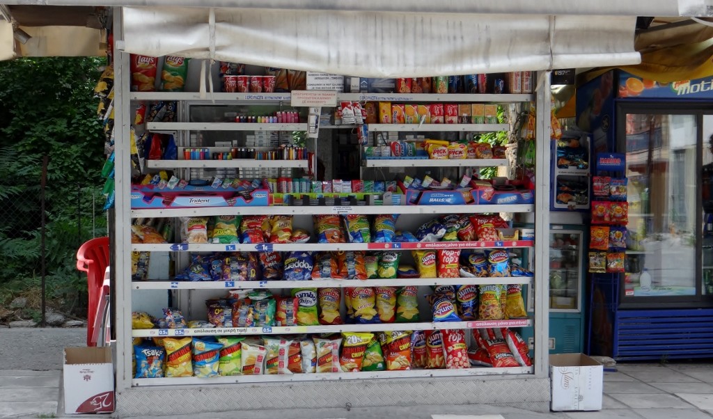 I love these little booths in Greece, you pick what you want and a face appears in the window in the middle.