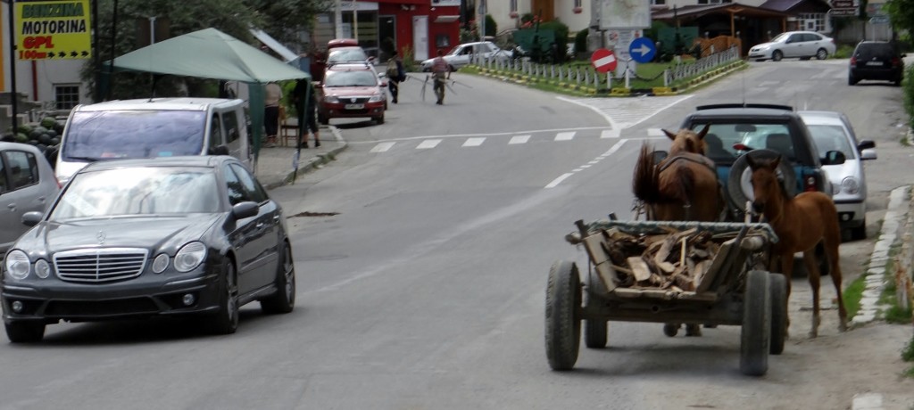 Its' not all old fashioned here, although those blokes in the middle background are walking down the street with scythes - is that legal in the UK?