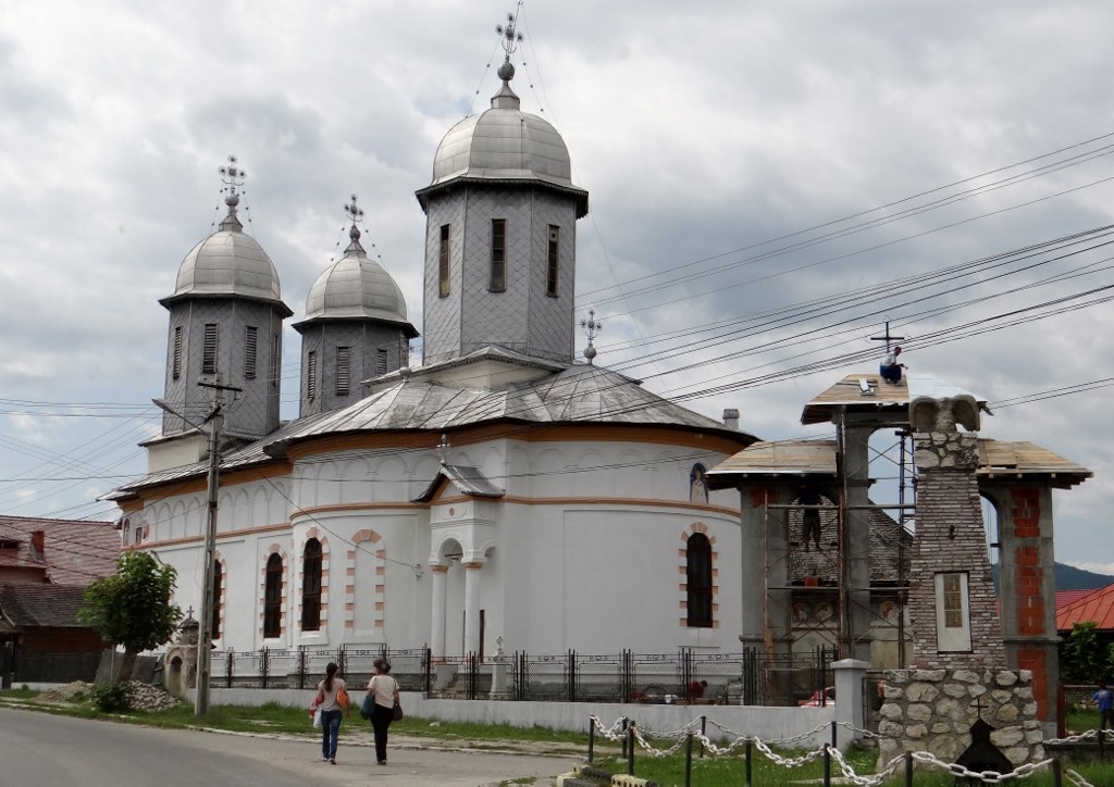 You need faith to fit a new roof to the church entrance here!