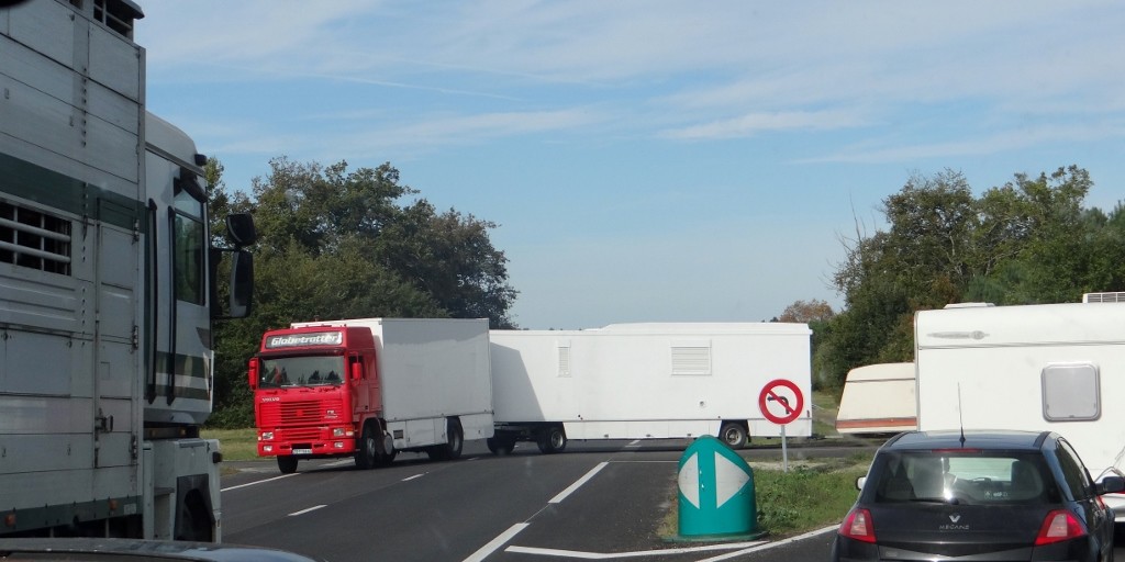 his shadow is towing the van and caravan - and yes it's doing a u-turn in the path of an oncoming truck!