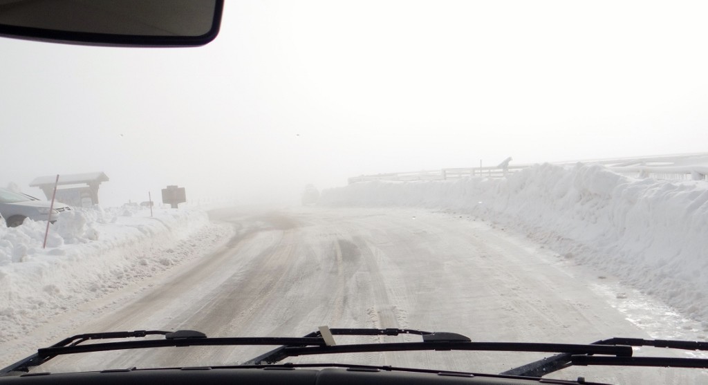 Oh sh*t! Reaching the col, the road went a bit white, as did my face.