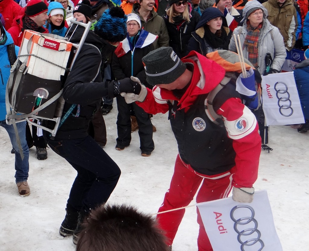 Very important lady being helped on the ice- she has the mulled wine on her back.