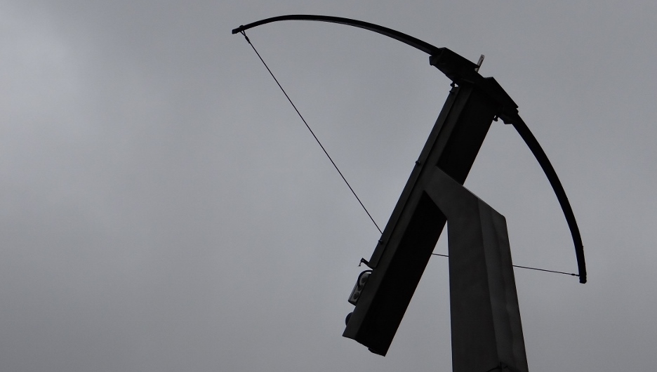 And above the toilet? A crossbow, of course.