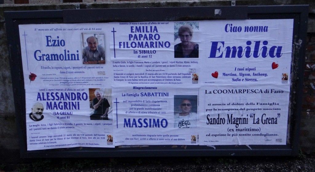 As we walked to the beach we passed the church, a group of old ladies stood reading the 'Morti' board.