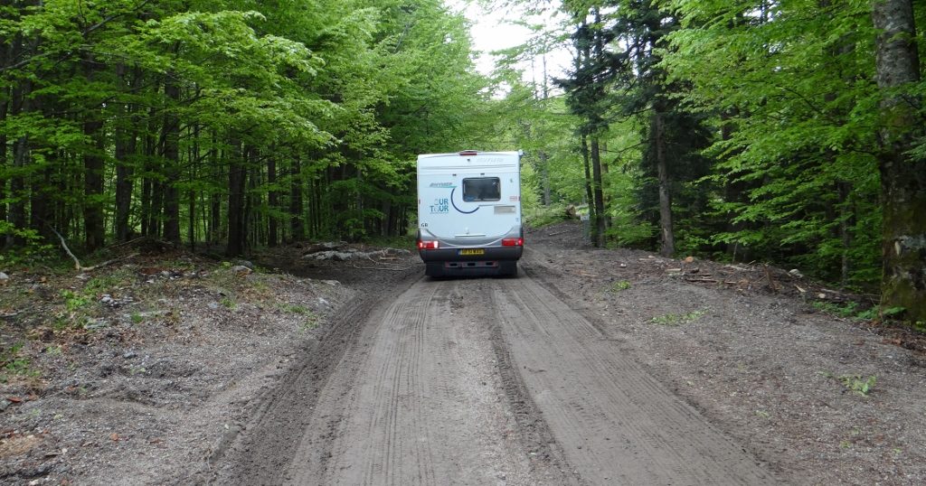 Reversing off the mud before our whistling saviour came to the rescue