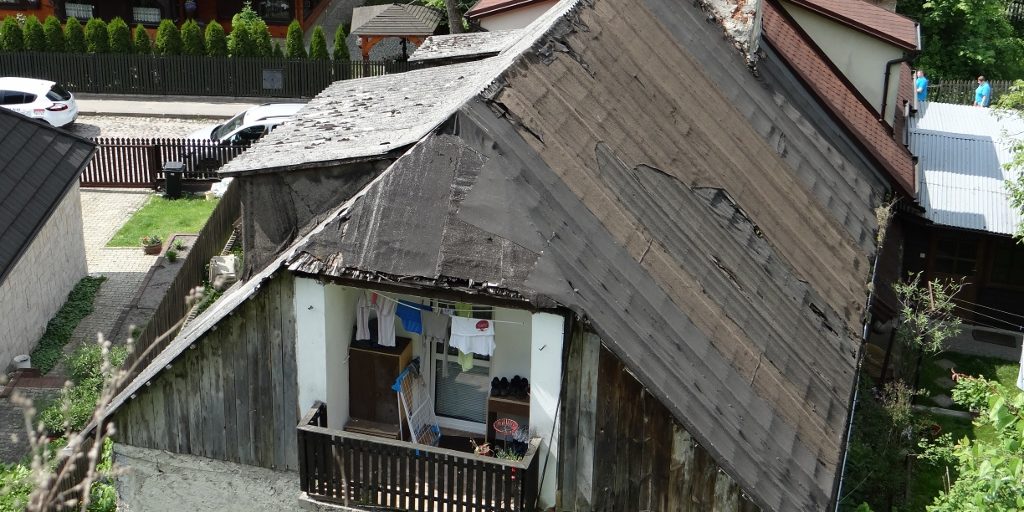 Just outside the centre, not all roofs are in such good nick...