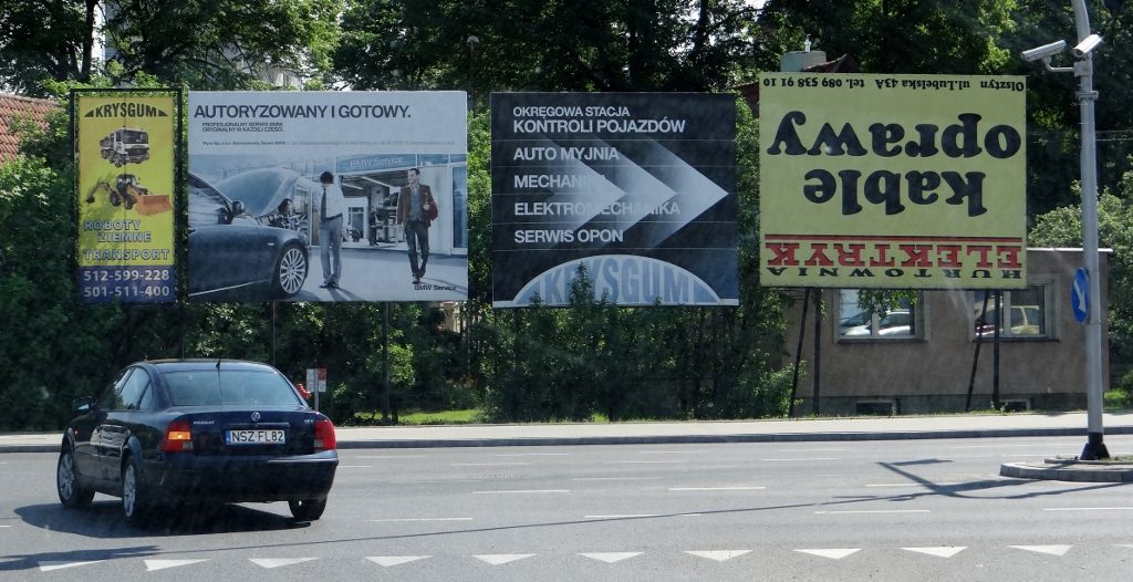 Upside down poster at traffic lights