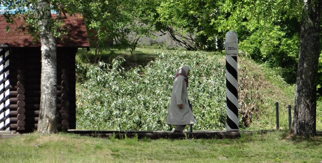 A lady crossing the border on foot. No customs, no passport, no queues