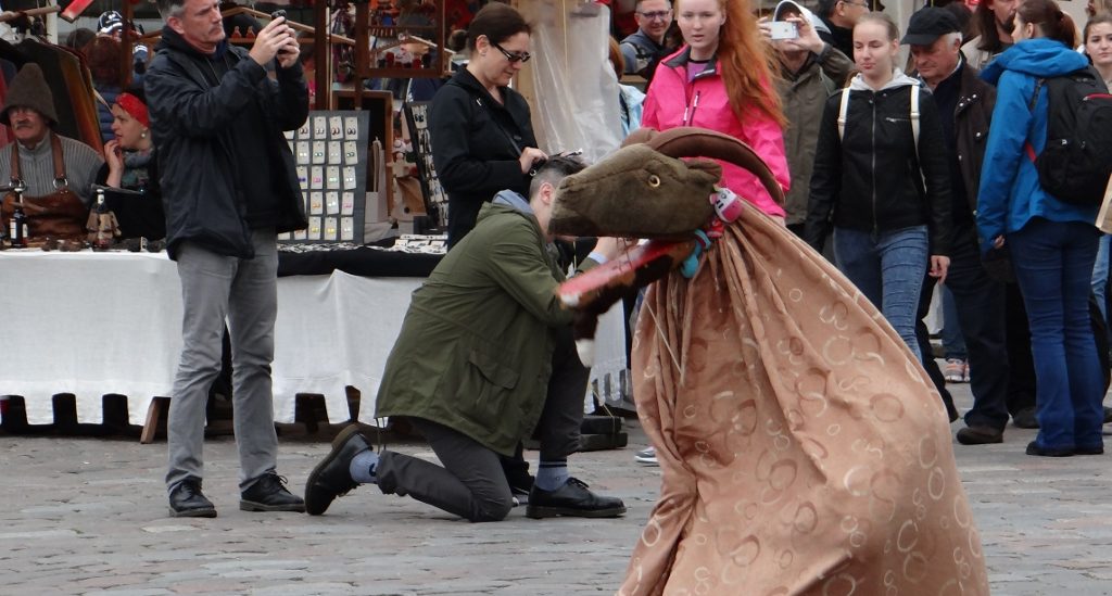 The goat's wooden mouth clapped open and closed while the chap inside whined and yammered. Go figure.