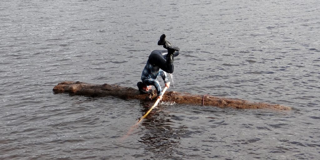 No mention of wearing women's clothing, but he could do a mean log-hand-stand thing