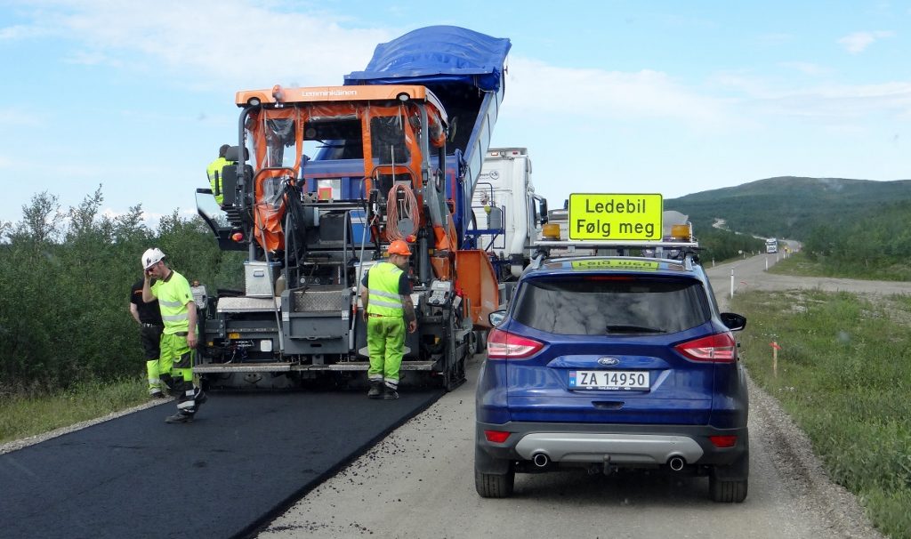 Safety cars accompanied us through roadworks as new stretches of road were born as we passed. No traffic lights here either, folks are paid to stand and hold a red paddle telling you to stop and wait for the car to come. Norwegian's vaguely understandable too: Følg Meg - follow me! 