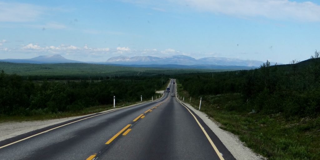 Norway, you beauty! If we could have reached them thar hills, we'd have hugged 'em. This is the Norwegian Arctic, and we were in love with it already.