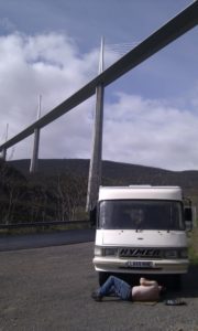 Adjusting Dave's clutch cable under the Millau Viaduct