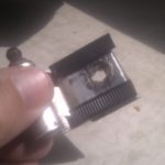 One of mainly Heath Robinson attempts at replacement hinges