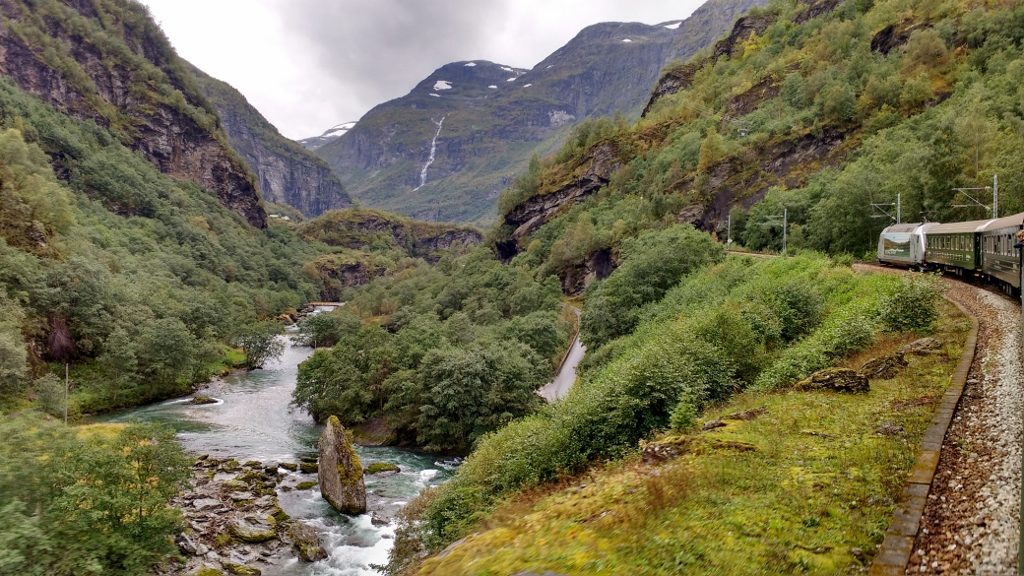 Flåm railway heading for the hills through ten stations, twenty tunnels and a bridge