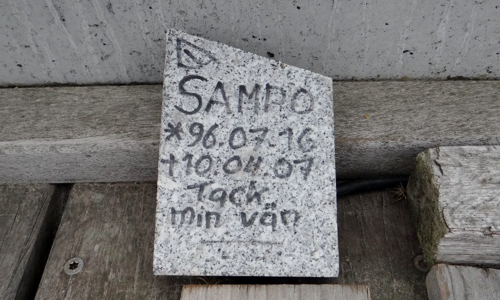 Plaque next to the boat above - presumably for a passed away pooch friend