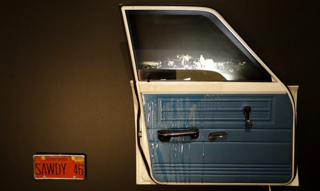 The image through the window is a real one - taken in the US south where a man was being attacked for not being white. This one had me shivering