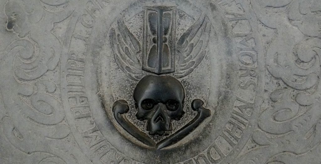 Inside Ribe Cathedral. I can't read the text, but I assume the meaning to be: Get Your Stuff Done Folks, Time is Ticking'