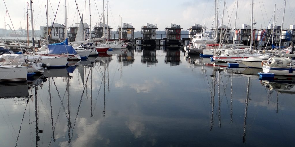I'm looking out of our side windows at the Fali whose cargo of coal is being craned off her. A short walk away there's a pleasure marina while looks much plusher