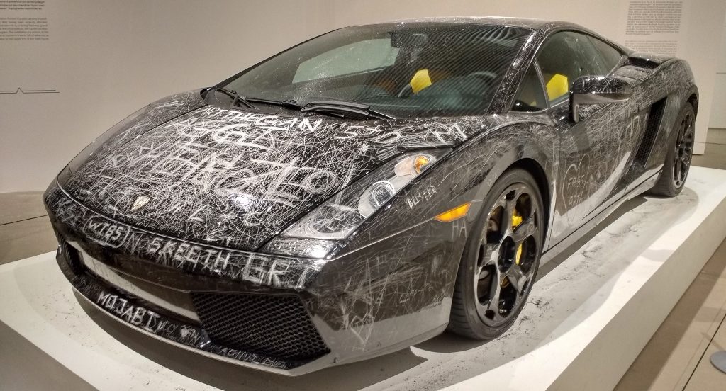 This was a shock to me: a brand new sportscar scratched to high hell by us punters. A sign stated the author thinks it's been scratched enough, so I had to pop my keys back in my pocket