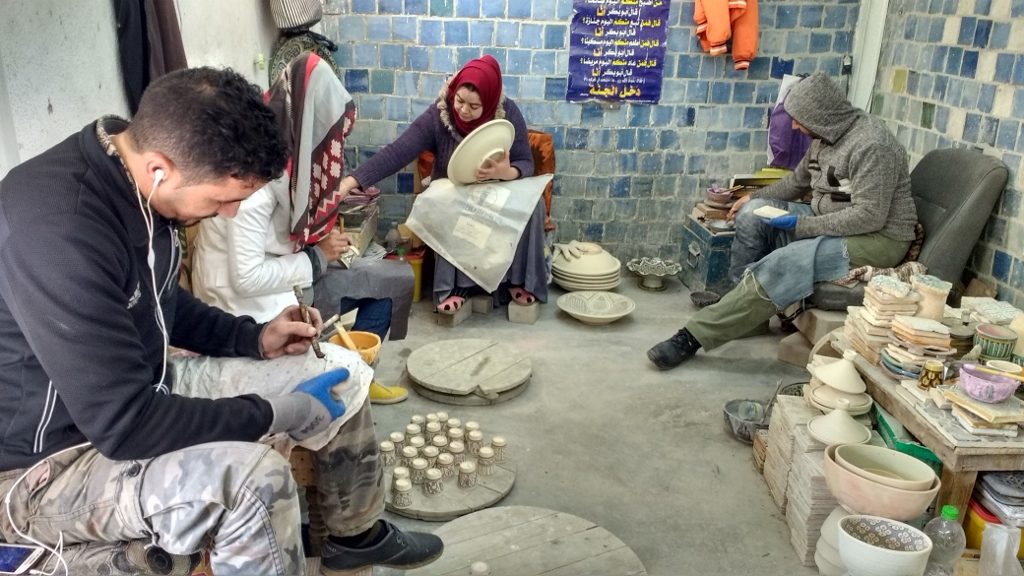 Pottery being painted by hand