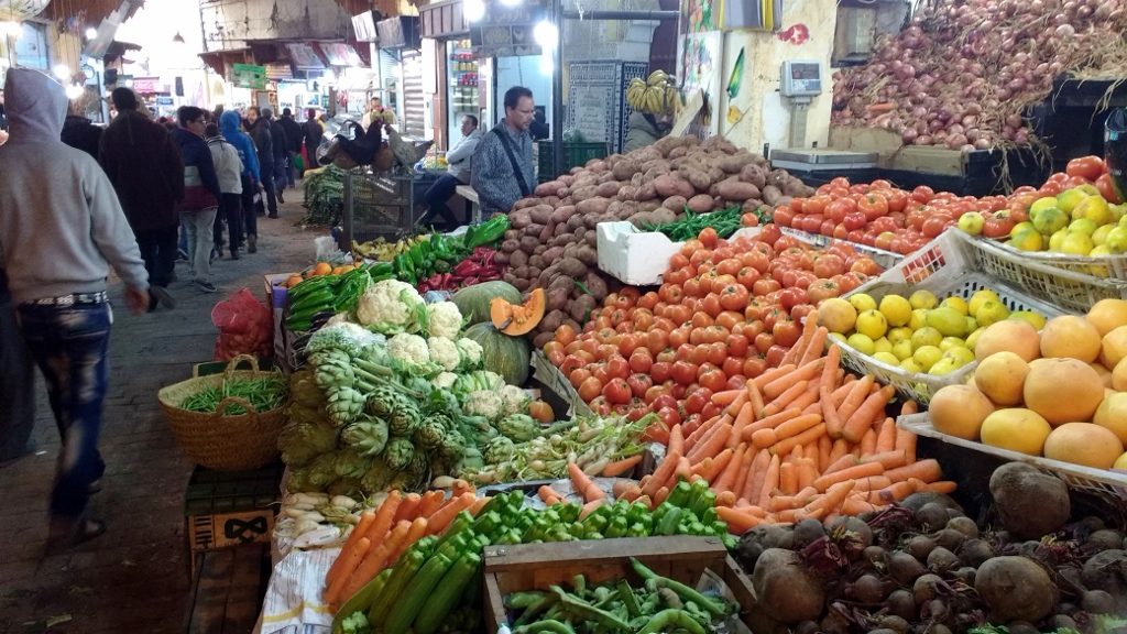 Buying veg in the Fes medina. You just get a washing up bowl and fill it with the stuff you want. He weighs it and then quotes the price, which will probably be low