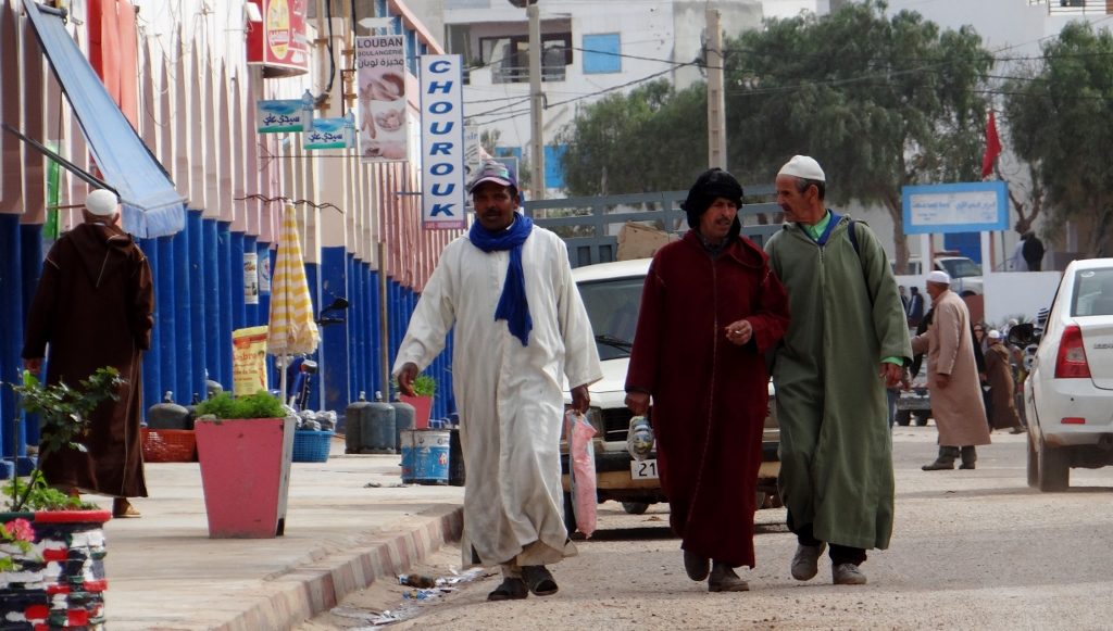 Locals walking the high street in Mirleft
