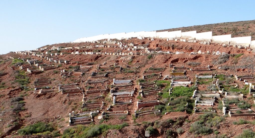 The graveyard overlooking the town from the other side of the dry river bed